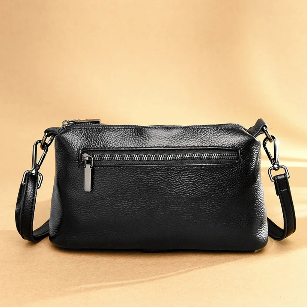 Bolso bandolera de piel vacuna · 3 compartimentos con cremallera