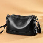 Bolso bandolera de piel vacuna · 3 compartimentos con cremallera